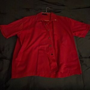 Large button up shirt from Steady with dollar bill signs on the buttons.